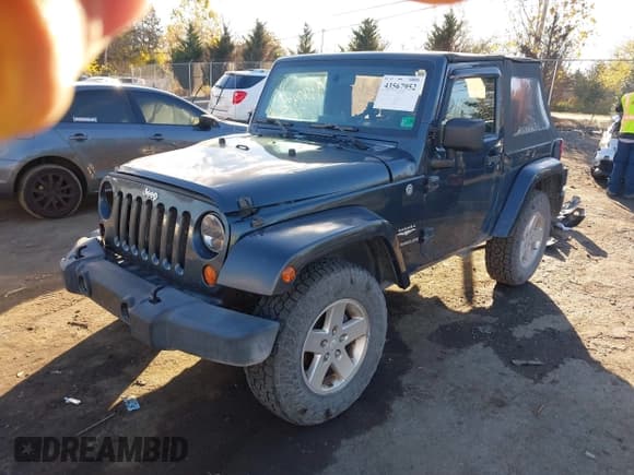 ✅ 2007 Jeep Wrangler Sahara • VIN: 1J8FA54147L171035 • Лот: 43567952. Опубликован ранее на IAAI с пробегом 280 755 миль. Бесплатный доступ к архиву аукционных продаж из США и подробный отчёт об истории автомобиля на DreamBid. Изображение 2.
