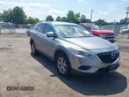 ✅ 2015 Mazda CX-9 Sport • VIN: JM3TB2BA3F0451593 • Lot: 42870124. Wystawiony na IAAI z przebiegiem 196 390 mil. Bezpłatny archiwum sprzedaży aukcyjnych z USA i szczegółowy raport historii pojazdu na DreamBid. Zdjęcie 1.