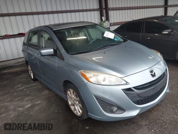 ✅ 2012 Mazda 5 Touring • VIN: JM1CW2CL1C0131939 • Lot: 43552511. Listed on IAAI with 171,138 mi. Free auction sales archive from the USA and detailed vehicle history report at DreamBid. Image 1.