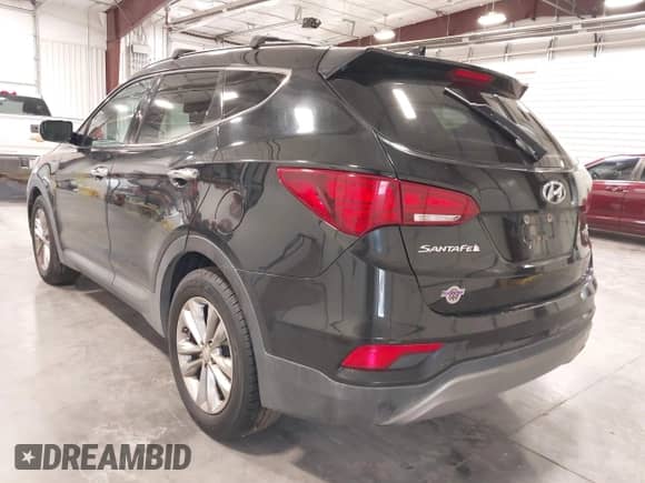 2017 Hyundai Santa Fe 2.0T z VIN 5XYZUDLA9HG433491, wystawiony jako IAAI lot #43298379 z przebiegiem 135 099 mil mil oraz . Historia ofert i sprzedaży dostępna na DreamBid. Obrazek 3.
