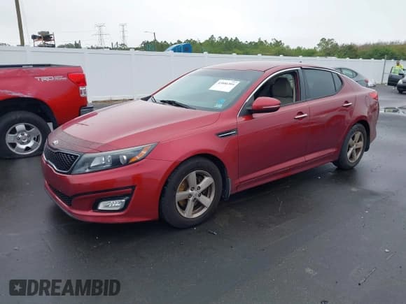 ✅ 2015 Kia Optima LX • VIN: 5XXGM4A79FG393526 • Lot: 43886304. Listed on IAAI with 136,305 mi. Free auction sales archive from the USA and detailed vehicle history report at DreamBid. Image 2.