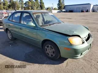 2003 Hyundai Accent GL with VIN KMHCG45C63U430403, listed as a Copart auction lot 86430724 with 74,200 mi miles and Salvage title. Bid and sale history available at DreamBid. Image 4.