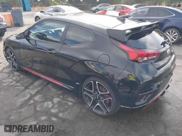 2022 Hyundai Veloster with VIN KMHT36AH1NU014206, listed as a IAAI auction lot 41202982 with 26,572 mi miles and . Bid and sale history available at DreamBid. Image 3.