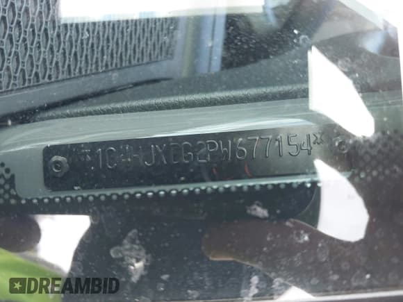 ✅ 2023 Jeep Wrangler Sport • VIN: 1C4HJXDG2PW677154 • Lot: 43756077. Listed on IAAI with 35,896 mi. Free auction sales archive from the USA and detailed vehicle history report at DreamBid. Image 9.