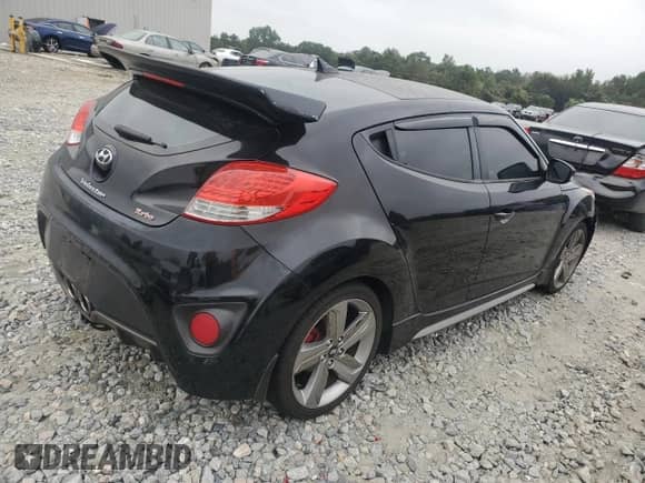 2013 Hyundai Veloster Turbo с VIN KMHTC6AE0DU172251, выставлен на аукционе Copart как лот 81363875 с пробегом 148 591 миль миль и Списание • Salvage title. История ставок и продаж доступна на DreamBid. Изображение 3.