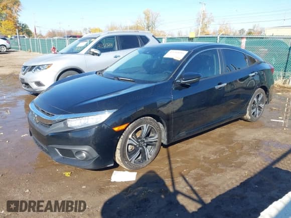 ✅ 2017 Honda Civic Touring • VIN: 19XFC1F99HE025978 • Lot: 43544695. Listed on IAAI with 123,323 mi. Free auction sales archive from the USA and detailed vehicle history report at DreamBid. Image 18.