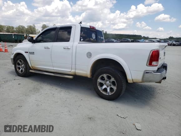 ✅ 2015 Ram 1500 Laramie • VIN: 1C6RR7JMXFS631477 • Lot: 66946105. Listed on Copart with 152,007 mi. Free auction sales archive from the USA and detailed vehicle history report at DreamBid. Image 2.