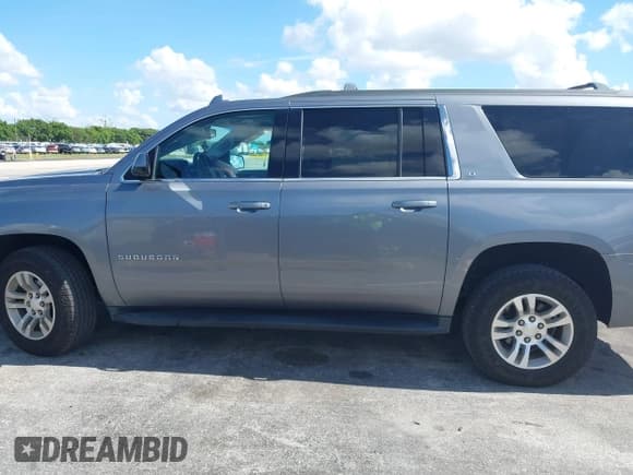 ✅ 2020 Chevrolet Suburban LT • VIN: 1GNSCHKC4LR302047 • Lot: 42518927. Listed on IAAI with 105,760 mi. Free auction sales archive from the USA and detailed vehicle history report at DreamBid. Image 14.