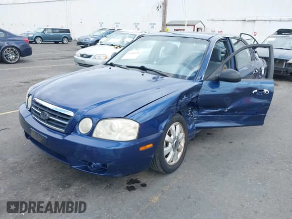 ✅ 2005 Kia Optima LX • VIN: KNAGD128455390068 • Lot: 42466140. Listed on IAAI with 128,832 mi. Free auction sales archive from the USA and detailed vehicle history report at DreamBid. Image 2.