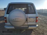 ✅ 1999 Isuzu Trooper S • VIN: JACDJ58X1X7931474 • Lot: 80273494. Listed on Copart with 295,128 mi. Free auction sales archive from the USA and detailed vehicle history report at DreamBid. Image 6.