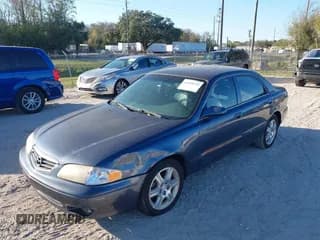 ✅ 2002 Mazda 626 LX • VIN: 1YVGF22D925287959 • Lot: 41610932. Wystawiony na IAAI z przebiegiem 122 333 mil. Bezpłatny archiwum sprzedaży aukcyjnych z USA i szczegółowy raport historii pojazdu na DreamBid. Zdjęcie 6.