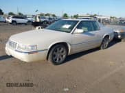 ✅ 2001 Cadillac Eldorado ESC • VIN: 1G6EL12Y81B104914 • Lot: 42664150. Wystawiony na IAAI z przebiegiem 124 984 mil. Bezpłatny archiwum sprzedaży aukcyjnych z USA i szczegółowy raport historii pojazdu na DreamBid. Zdjęcie 2.