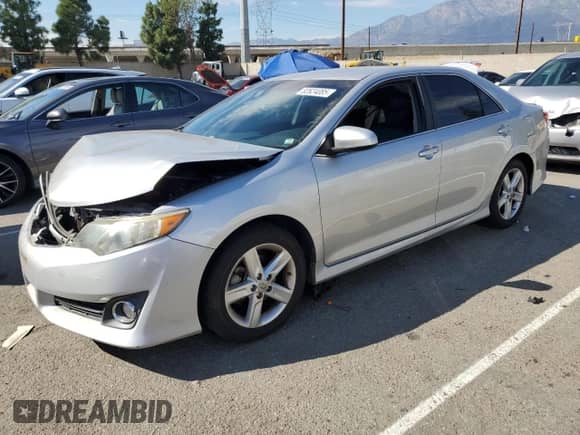 2014 Toyota Camry L with VIN 4T1BF1FK4EU817814, listed as a Copart auction lot 82624085 with 142,812 mi miles and Salvage title. Bid and sale history available at DreamBid. Image 1.
