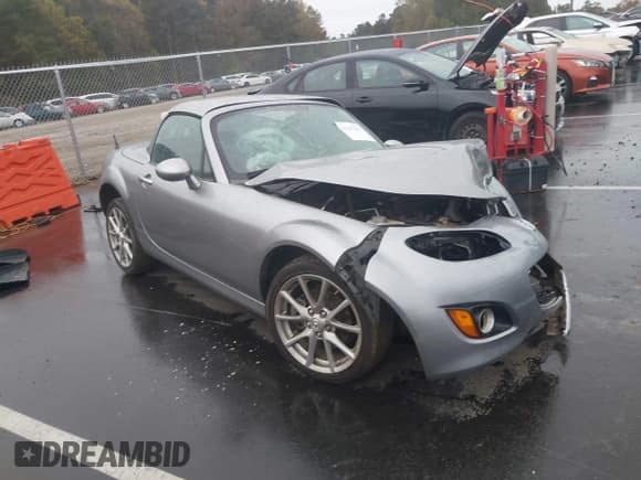 ✅ 2012 Mazda MX-5 Miata Grand Touring • VIN: JM1NC2PF2C0222885 • Lot: 43547461. Listed on IAAI with 82,803 mi. Free auction sales archive from the USA and detailed vehicle history report at DreamBid. Image 1.