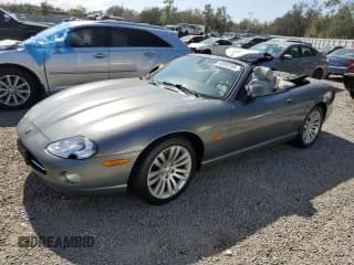 ✅ 2005 Jaguar XK XK8 • VIN: SAJDA42C152A44151 • Лот: 43853165. Опубликован ранее на Copart с пробегом 100 447 миль. Бесплатный доступ к архиву аукционных продаж из США и подробный отчёт об истории автомобиля на DreamBid. Изображение 1.