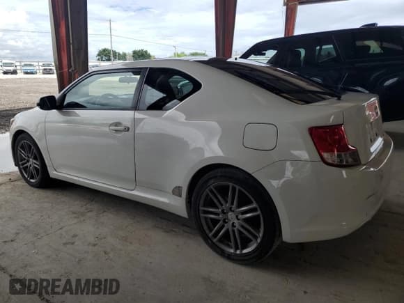✅ 2012 Scion tC • VIN: JTKJF5C71C3026949 • Лот: 81311925. Опубликован ранее на Copart с пробегом 150 221 миль. Бесплатный доступ к архиву аукционных продаж из США и подробный отчёт об истории автомобиля на DreamBid. Изображение 2.