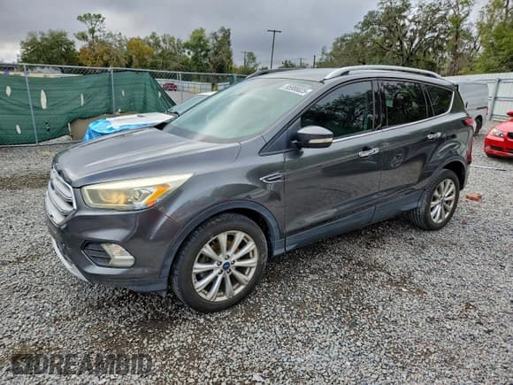✅ 2017 Ford Escape Titanium • VIN: 1FMCU0JDXHUD16122 • Lot: 95988025. Wystawiony na Copart z przebiegiem 63 513 mil. Bezpłatny archiwum sprzedaży aukcyjnych z USA i szczegółowy raport historii pojazdu na DreamBid. Zdjęcie 1.