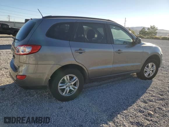 2012 Hyundai Santa Fe GLS с VIN 5XYZGDABXCG160265, выставлен на аукционе Copart как лот 70721424 с пробегом 115 181 миль миль и Списание • Salvage title. История ставок и продаж доступна на DreamBid. Изображение 3.