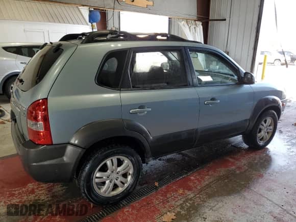 2006 Hyundai Tucson GLS with VIN KM8JN72D26U346076, listed as a Copart auction lot 77447474 with 123,993 mi miles and Salvage title. Bid and sale history available at DreamBid. Image 3.