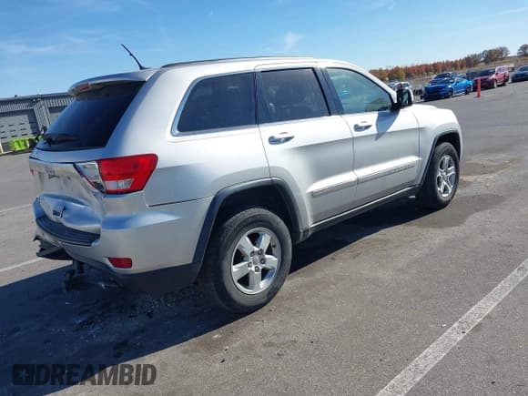 ✅ 2013 Jeep Grand Cherokee Laredo • VIN: 1C4RJFAG8DC607593 • Lot: 43643452. Listed on IAAI with 168,356 mi. Free auction sales archive from the USA and detailed vehicle history report at DreamBid. Image 4.