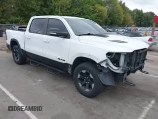 2019 Ram 1500 Rebel z VIN 1C6SRFLT2KN534007, wystawiony jako IAAI lot #43375553 z przebiegiem 113 737 mil mil oraz . Historia ofert i sprzedaży dostępna na DreamBid. Obrazek 1.