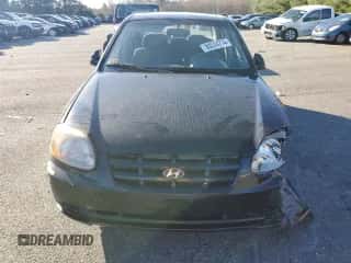 2005 Hyundai Accent GLS with VIN KMHCG45C15U662362, listed as a Copart auction lot 80574774 with 122,898 mi miles and Salvage title. Bid and sale history available at DreamBid. Image 5.