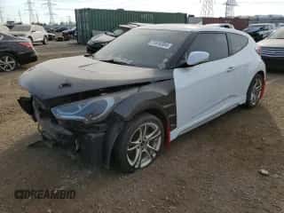 2013 Hyundai Veloster Turbo z VIN KMHTC6AE1DU126220, wystawiony jako Copart lot #71816384 z przebiegiem 128 943 mil mil oraz Szkoda całkowita • Salvage title. Historia ofert i sprzedaży dostępna na DreamBid. Obrazek 1.