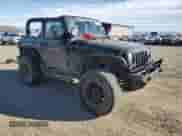 2012 Jeep Wrangler Sport with VIN 1C4AJWAG3CL258130, listed as a Copart auction lot 86983635 with 154,996 mi miles and Clean title. Bid and sale history available at DreamBid. Image 4.