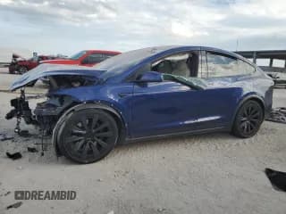 ✅ 2023 Tesla Model X • VIN: 7SAXCBE52PF384559 • Lot: 91859835. Wystawiony na Copart z przebiegiem 24 394 mil. Bezpłatny archiwum sprzedaży aukcyjnych z USA i szczegółowy raport historii pojazdu na DreamBid. Zdjęcie 1.