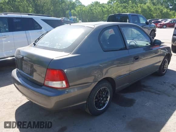 2001 Hyundai Accent GS z VIN KMHCG35C01U136132, wystawiony jako IAAI lot #42293830 z przebiegiem 111 906 mil mil oraz . Historia ofert i sprzedaży dostępna na DreamBid. Obrazek 4.