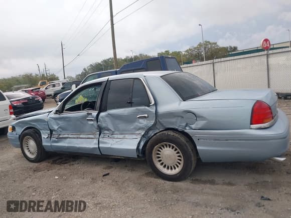 ✅ 1999 Ford Crown Victoria • VIN: 2FAFP73WXXX221069 • Lot: 41750127. Listed on IAAI with 177,142 mi. Free auction sales archive from the USA and detailed vehicle history report at DreamBid. Image 14.