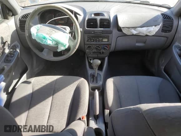 2003 Hyundai Accent GL with VIN KMHCG45C33U469496, listed as a Copart auction lot 45926595 with 77,737 mi miles and Salvage title. Bid and sale history available at DreamBid. Image 8.
