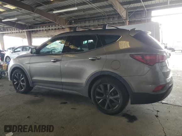 ✅ 2017 Hyundai Santa Fe Ultimate • VIN: 5XYZW4LA0HG407064 • Лот: 86272525. Опубликован ранее на Copart с пробегом 185 342 миль. Бесплатный доступ к архиву аукционных продаж из США и подробный отчёт об истории автомобиля на DreamBid. Изображение 2.