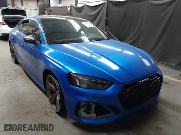 ✅ 2022 Audi RS 5 Sportback • VIN: WUAAWCF51NA902099 • Lot: 43455117. Listed on IAAI with 53,874 mi. Free auction sales archive from the USA and detailed vehicle history report at DreamBid. Image 1.