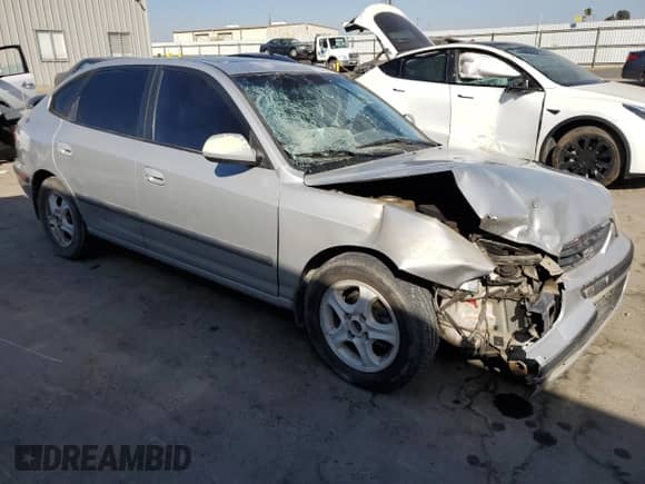 2002 Hyundai Elantra GT z VIN KMHDN55DX2U069068, wystawiony jako Copart lot #73525214 z przebiegiem 195 048 mil mil oraz Szkoda całkowita • Salvage title. Historia ofert i sprzedaży dostępna na DreamBid. Obrazek 4.