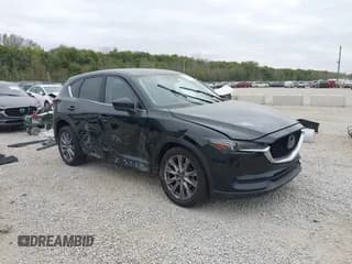 ✅ 2020 Mazda CX-5 Grand Touring • VIN: JM3KFBDM9L0780575 • Lot: 43452456. Listed on IAAI with 50,844 mi. Free auction sales archive from the USA and detailed vehicle history report at DreamBid. Image 1.