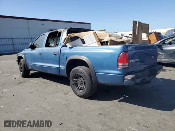 2003 Dodge Dakota Sport z VIN 1D7HL38X33S144315, wystawiony jako Copart lot #65842394 z przebiegiem Nie podano mil oraz Szkoda całkowita • Salvage title. Historia ofert i sprzedaży dostępna na DreamBid. Obrazek 2.