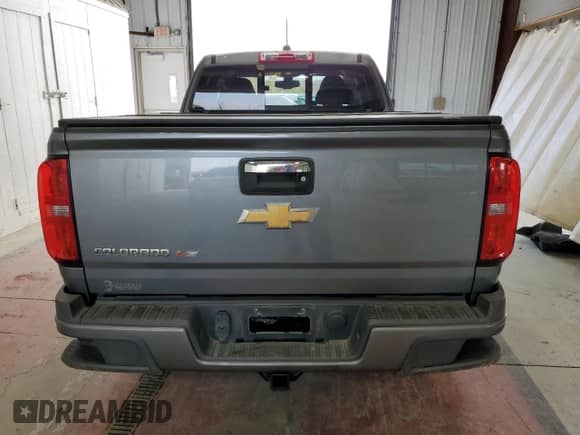 2018 Chevrolet Colorado 4WD Z71 with VIN 1GCHTDEN1J1284367, listed as a Copart auction lot 77316824 with 43,383 mi miles and Salvage title. Bid and sale history available at DreamBid. Image 6.