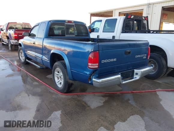 2003 Dodge Dakota SLT with VIN 1D7HL42N93S196397, listed as a IAAI auction lot 42105857 with 159,690 mi miles and . Bid and sale history available at DreamBid. Image 3.