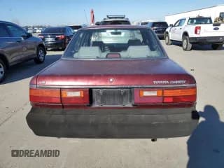 ✅ 1990 Toyota Camry • VIN: JT2SV21E7L3411990 • Lot: 88557555. Listed on Copart with 335,803 mi. Free auction sales archive from the USA and detailed vehicle history report at DreamBid. Image 6.