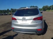 ✅ 2014 Hyundai Santa Fe • VIN: 5XYZUDLB4EG205418 • Lot: 43058157. Listed on IAAI with 137,818 mi. Free auction sales archive from the USA and detailed vehicle history report at DreamBid. Image 16.