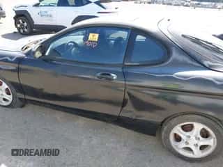 2000 Hyundai Tiburon z VIN KMHJG35F5YU191588, wystawiony jako IAAI lot #41934653 z przebiegiem 161 590 mil mil oraz . Historia ofert i sprzedaży dostępna na DreamBid. Obrazek 6.