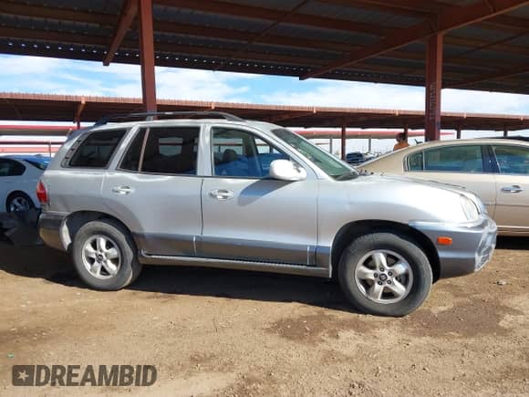 2004 Hyundai Santa Fe GLS z VIN KM8SC73DX4U624809, wystawiony jako IAAI lot #40739378 z przebiegiem 237 778 mil mil oraz . Historia ofert i sprzedaży dostępna na DreamBid. Obrazek 13.