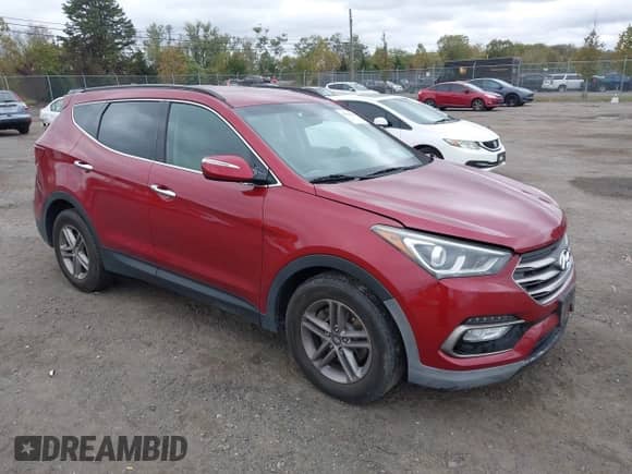 2017 Hyundai Santa Fe 2.4L z VIN 5XYZUDLB2HG385082, wystawiony jako IAAI lot #43416115 z przebiegiem Nie podano mil oraz . Historia ofert i sprzedaży dostępna na DreamBid. Obrazek 1.