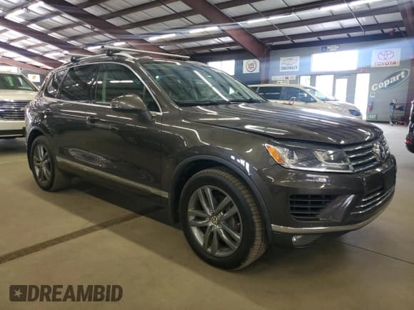 ✅ 2015 Volkswagen Touareg Sport • VIN: WVGEF9BP3FD001675 • Лот: 85270765. Опубликован ранее на Copart с пробегом 182 412 миль. Бесплатный доступ к архиву аукционных продаж из США и подробный отчёт об истории автомобиля на DreamBid. Изображение 4.