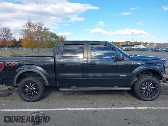 ✅ 2014 Ford F-150 Platinum • VIN: 1FTFW1ET5EFC89771 • Lot: 43499145. Wystawiony na IAAI z przebiegiem 174 908 mil. Bezpłatny archiwum sprzedaży aukcyjnych z USA i szczegółowy raport historii pojazdu na DreamBid. Zdjęcie 13.