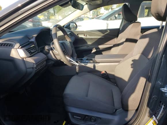 2025 Toyota Camry LE with VIN 4T1DAACK8SU067003, listed as a Copart auction lot 84061975 with 9,394 mi miles and Salvage title. Bid and sale history available at DreamBid. Image 7.