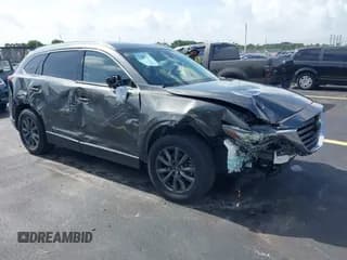 ✅ 2021 Mazda CX-9 Touring • VIN: JM3TCACY1M0503979 • Lot: 42650572. Wystawiony na IAAI z przebiegiem 28 673 mil. Bezpłatny archiwum sprzedaży aukcyjnych z USA i szczegółowy raport historii pojazdu na DreamBid. Zdjęcie 1.