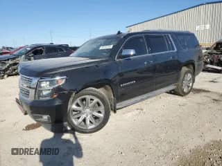 2019 Chevrolet Suburban Premier with VIN 1GNSCJKCXKR408508, listed as a Copart auction lot 50618465 with 79,258 mi miles and Salvage title. Bid and sale history available at DreamBid. Image 1.