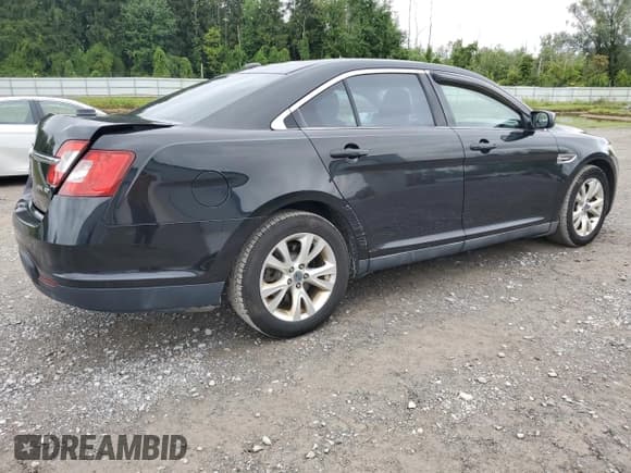 ✅ 2011 Ford Taurus SEL • VIN: 1FAHP2HW8BG118686 • Lot: 69949995. Listed on Copart with 128,437 mi. Free auction sales archive from the USA and detailed vehicle history report at DreamBid. Image 3.